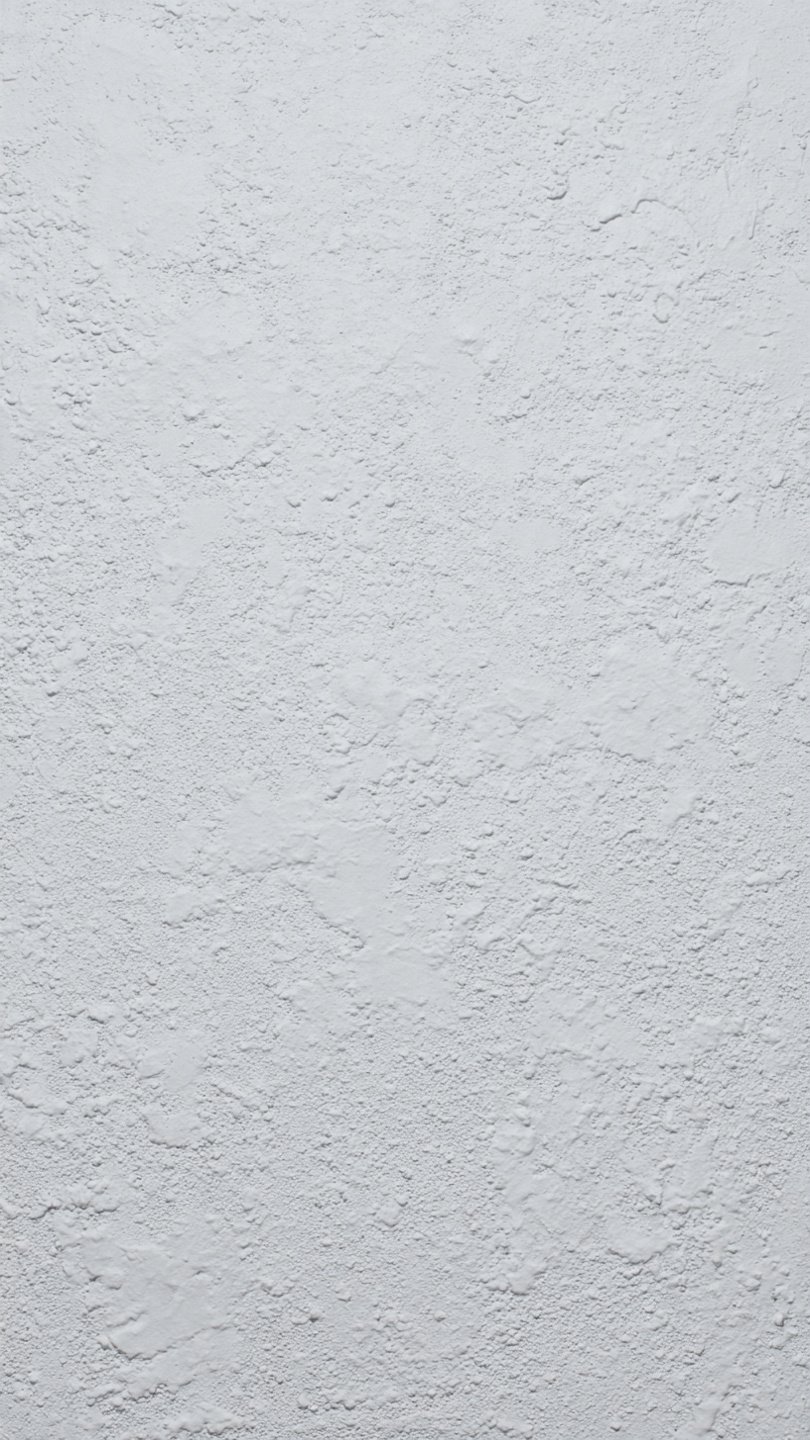 application de peinture blanche sur mur enduit